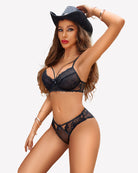 Black lace bra and panty set with thin straps, bow detail, and sheer sides