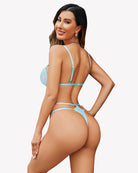 Light blue deep V teddy one-piece back view with thin straps and lace cut-out sections