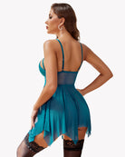 Blue-green lace babydoll dress back view with thin straps and flared sheer hem