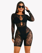 Black lace cut-out fishnet bodysuit dress with long sleeves and cheeky shorts