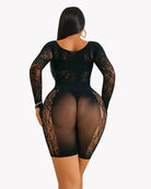 Black lace cut-out fishnet bodysuit dress, back view with oval cutouts and long sleeves