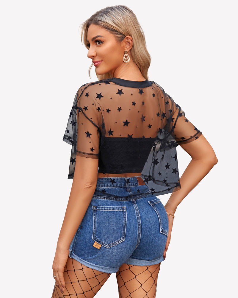 Side view of black mesh see-through top with star print, short sleeves