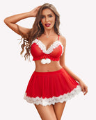 Red bra and mini skirt set with white lace trim, bow detail, and pom accents