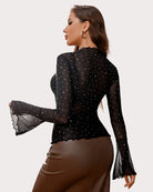 Black rhinestone mesh top with V-neck bodice, long sleeves, and scalloped cuffs