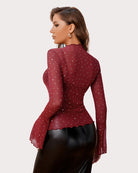 Red rhinestone mesh top back view with long flared sleeves and peplum hem