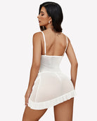 White lace babydoll hip dress with open back straps and ruffled hem