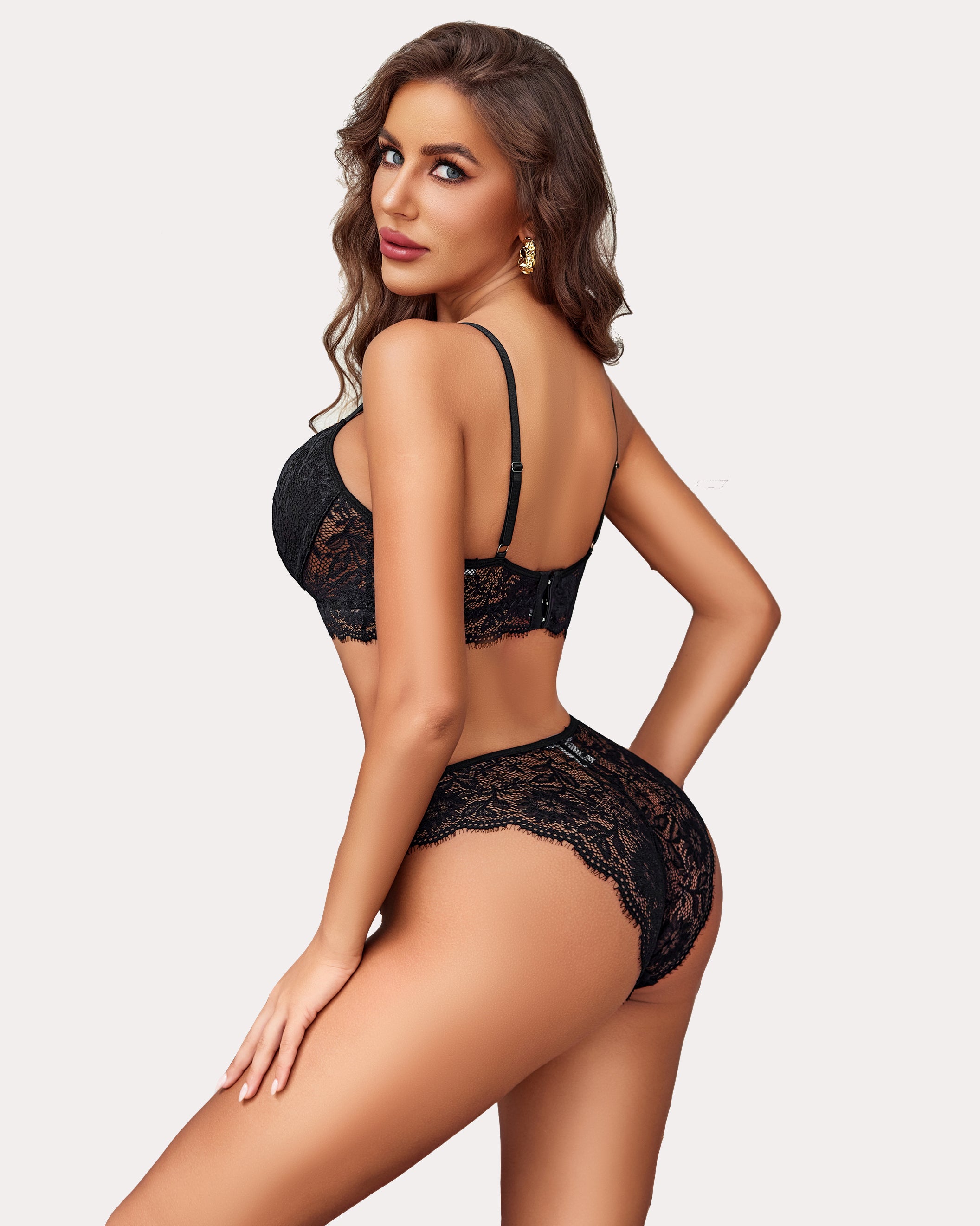 Black lace bra and panty set shown from the side/back, scalloped lace trim