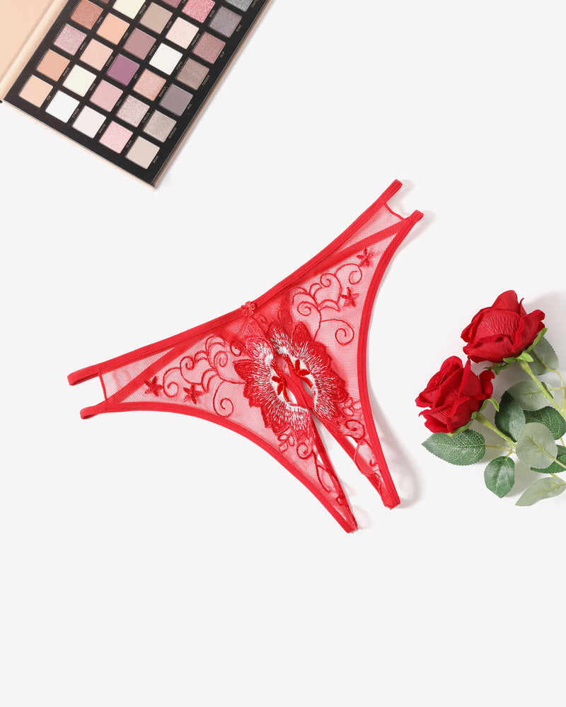 Red embroidered thong panties with floral swirls and scalloped lace edges