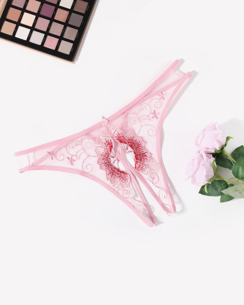 Light pink embroidered thong panties with red eyelet floral swirl and center bow detail