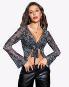 Mesh crop top with long sleeves, tie-front knot, deep V neckline, dark repeating pattern