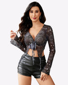 Mesh crop top with long sleeves, tie-front knot, deep V neckline, dark celestial print