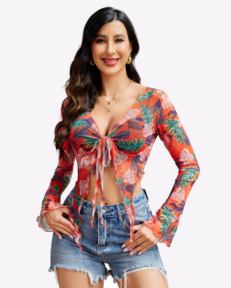 Mesh crop top with long sleeves, tie-front detail, and orange tropical floral print