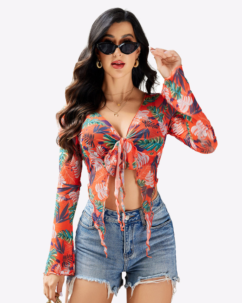Mesh crop top with tie-front V-neck, long sleeves, orange-red tropical leaf print