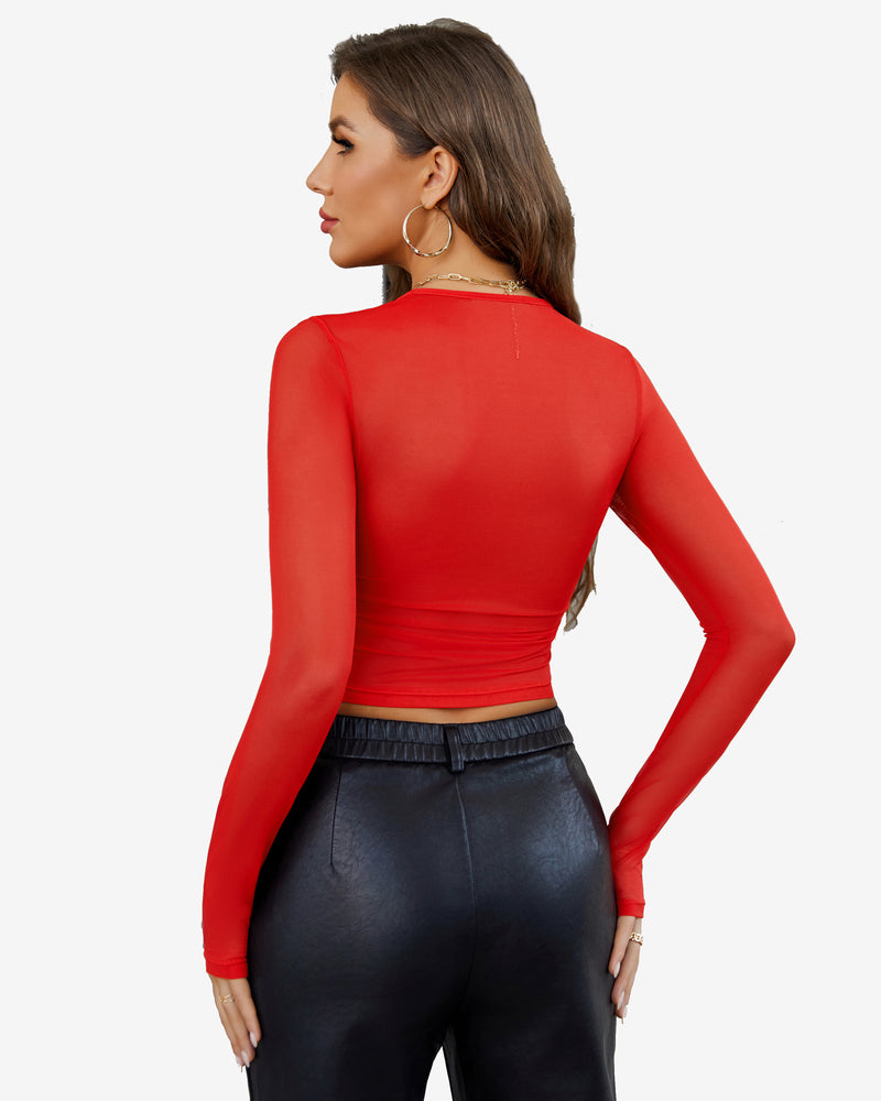 Sheer mesh long sleeve crop top in red, back view with ruched waist seam