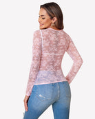 Pink sheer lace mesh long sleeve blouse with round neckline and all-over floral motif