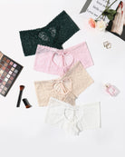 High-waist lace boyshort panties set in dark green, light pink, beige, and white.