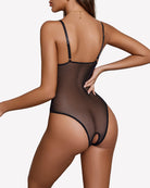 Black lace harness bodysuit with sheer back, thin straps, and cutout leg opening
