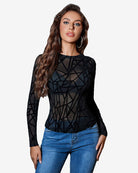 Black sheer blouse with geometric pattern, long sleeves, drawstring waist