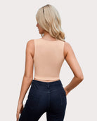 Beige cut-out crop tank top back view, sleeveless high neckline