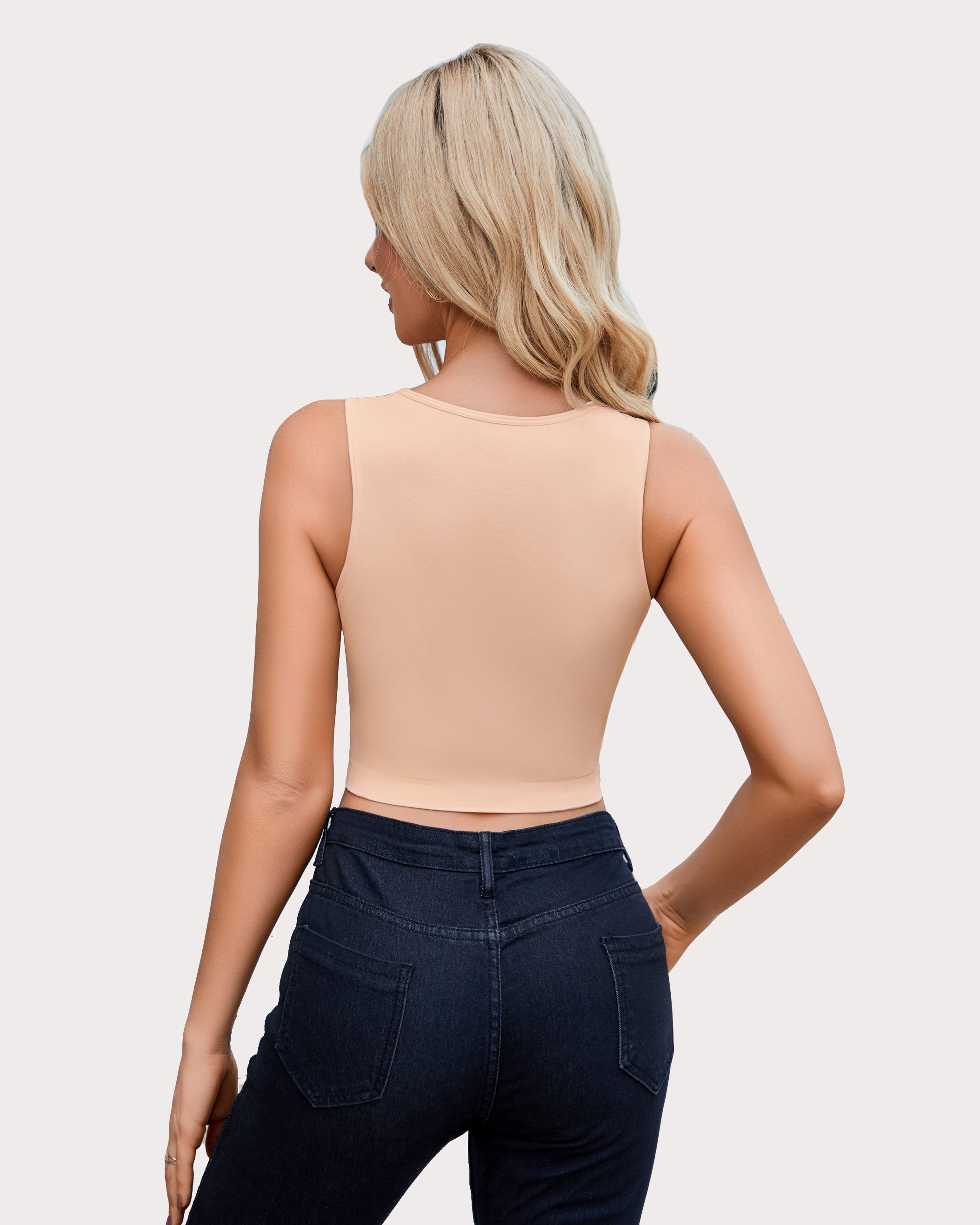 Beige cut-out crop tank top back view, sleeveless high neckline