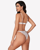 Lace teddy one-piece lingerie, white lace back view with center strap and thong bottom