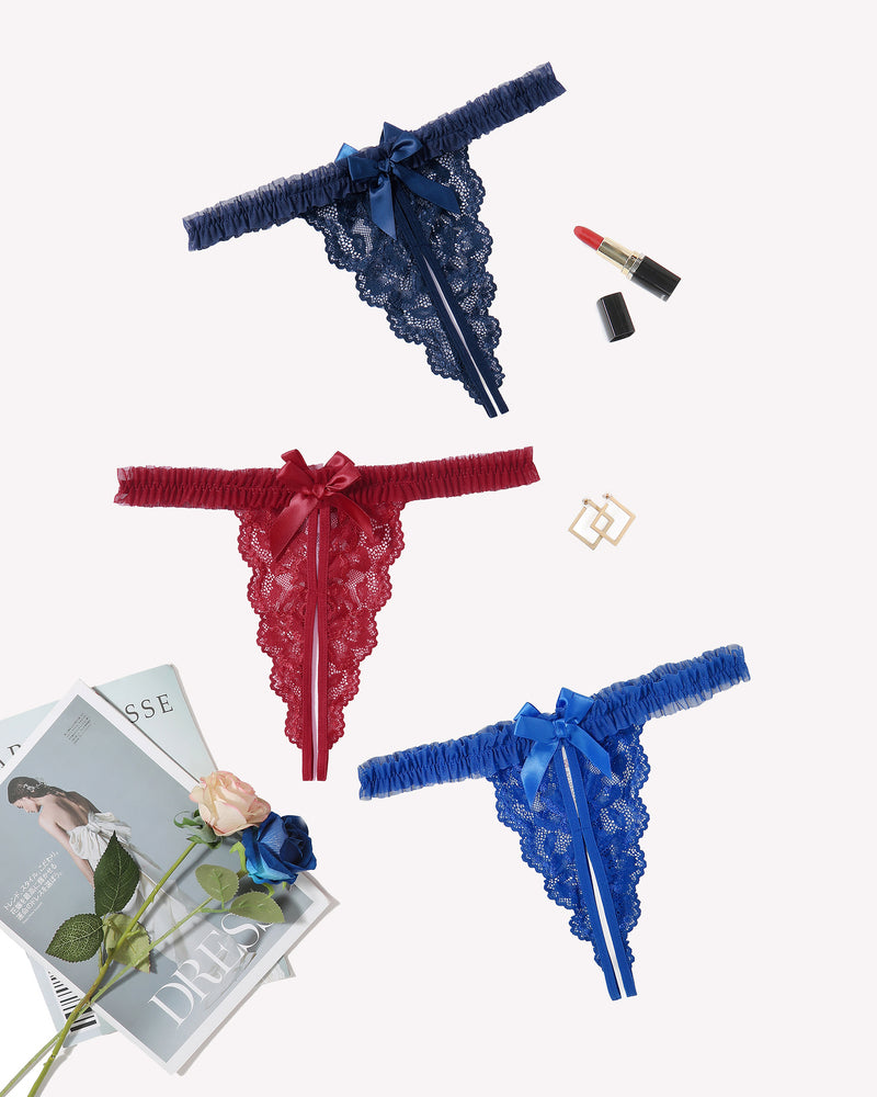Three floral lace thong panties: dark blue, red, and blue with satin bows
