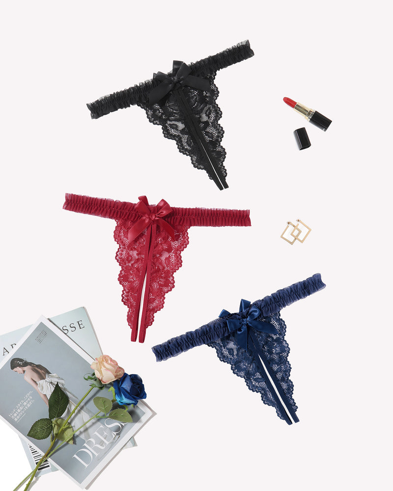 Three floral lace thong panties: black, red, and blue with satin bows