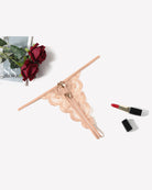 Beige lace low-rise thong panties with front bow and scalloped trim