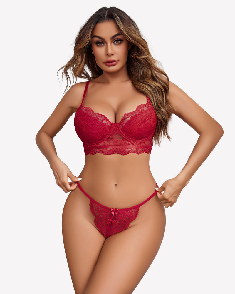 Red lace low-rise thong panties with bow detail and scalloped lace trim on model