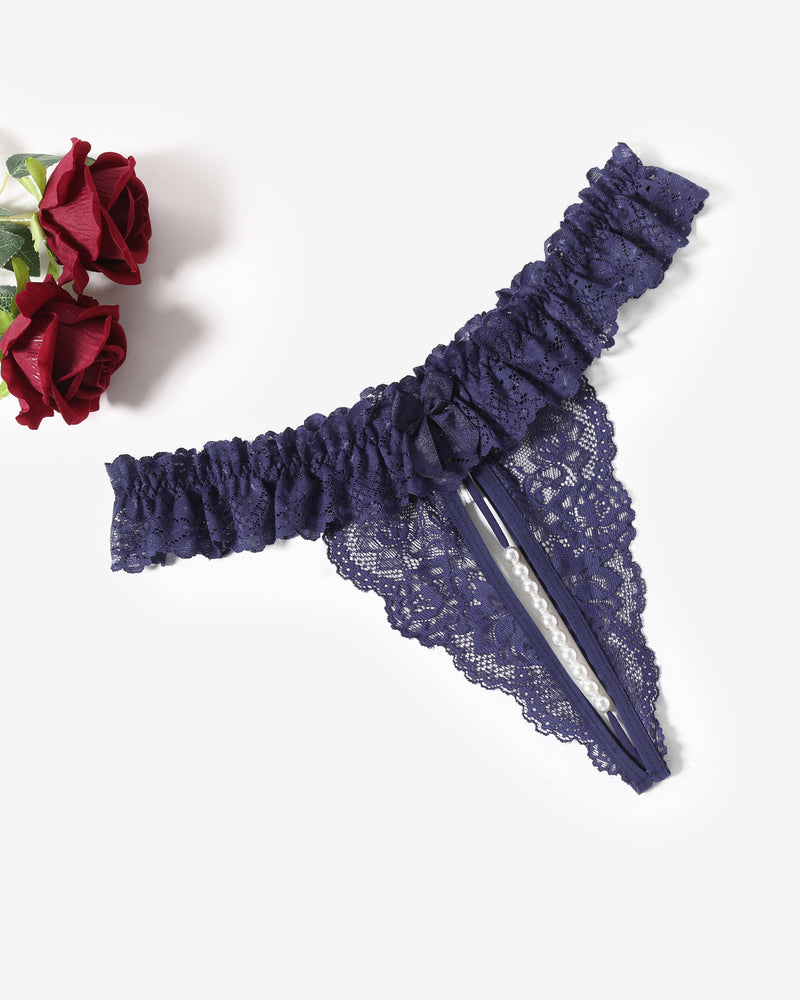 Navy lace low waist thong with ruffled waistband, bow detail, and pearl bead drop.
