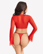 Sheer red long-sleeve crop top from back with matching g-string thong.