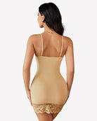 Back view beige lace-trim mini slip dress with thin straps and lace hem