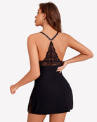 Black lace backless chemise with crisscross straps and scalloped lace hem