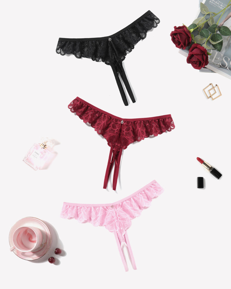 Lace thong briefs in black, wine red, and light pink with scalloped lace edges