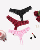 Lace thong briefs set in black, wine red, and light pink with scalloped trim