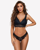 Navy lace criss-cross thong briefs worn by a model, scalloped lace trim