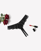 Black lace criss-cross thong briefs with scalloped ruffle edge and side ties