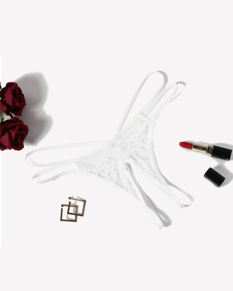 White lace g-string thong with thin strappy sides and floral mesh center