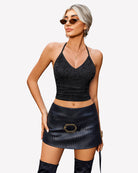 Black lace halter crop camisole top with V-neck and textured lace overlay.