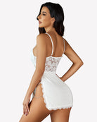 White lace babydoll lingerie with thin straps, mesh bodice, and scalloped hem