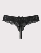 Black lace thong panties with bow and long ribbon ties, flat lay