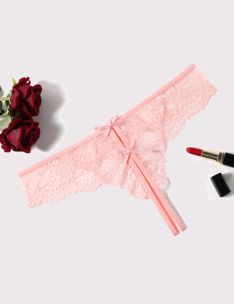 Pink lace thong panties with bow ties and scalloped edges