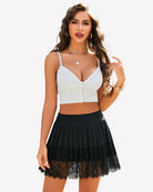 Black high-waist pleated mini skirt with scalloped lace edge and sheer lace bottom
