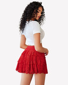 Red lace mini skirt with pleats and flared tiered ruffles