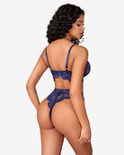 Dark blue lace bra with thin straps and matching lace panty, rear view
