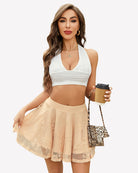 Lace pleated skater skirt in champagne with lace texture and ruffled hem