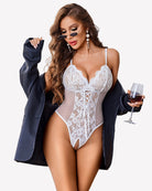 White lace one-piece teddy bodysuit with thin straps and center corset lacing