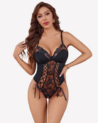 Black lace-up front crotchless bodysuit with floral lace panels and tie side details.