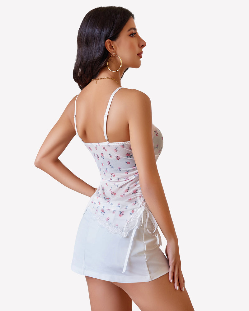 White sheer cami top with lace-back straps and side drawstring waist ties