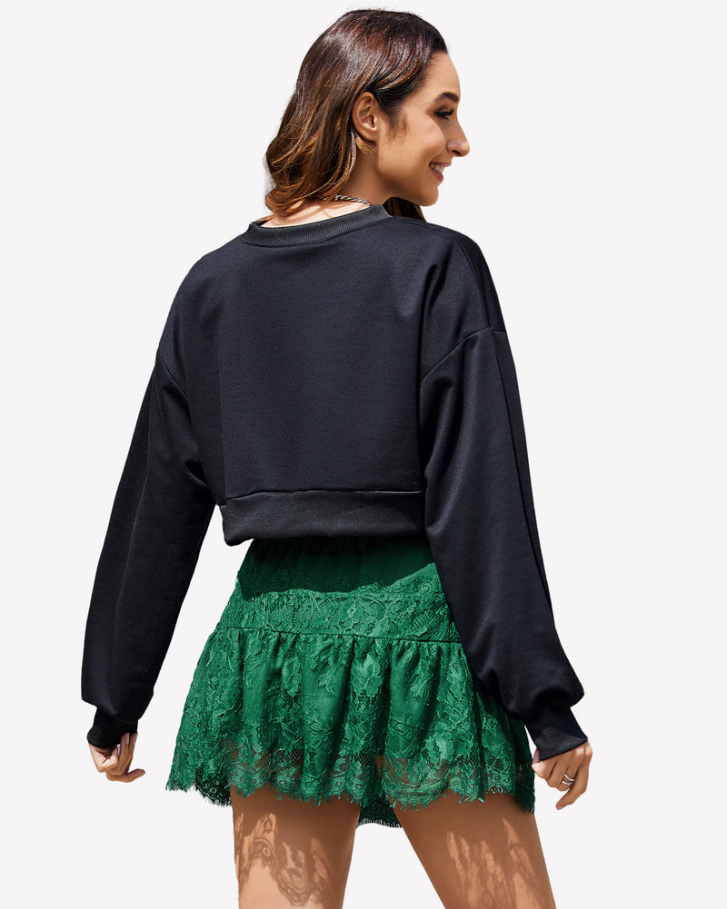 Green lace tier mini skirt with elastic waistband, ruffled design, scalloped hem